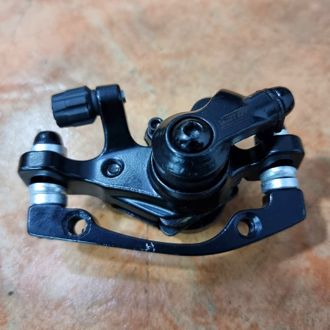 In a disc-brake system, the brake caliper is crucial. It serves as a support bracket for the brake pads on either side of the rotor, as well as the caliper bracket. The objective of a brake caliper is to squeeze the brake pads against the rotor in order to bring the electric bicycle to a halt.