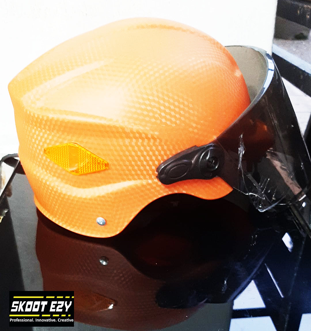 This orange half helmet is made from Acrylonitrile Butadiene Styrene (ABS) impact resistant thermoplastic. The ABS material is an excellent choice for a helmet because it can withstand extreme temperatures without warping or cracking.